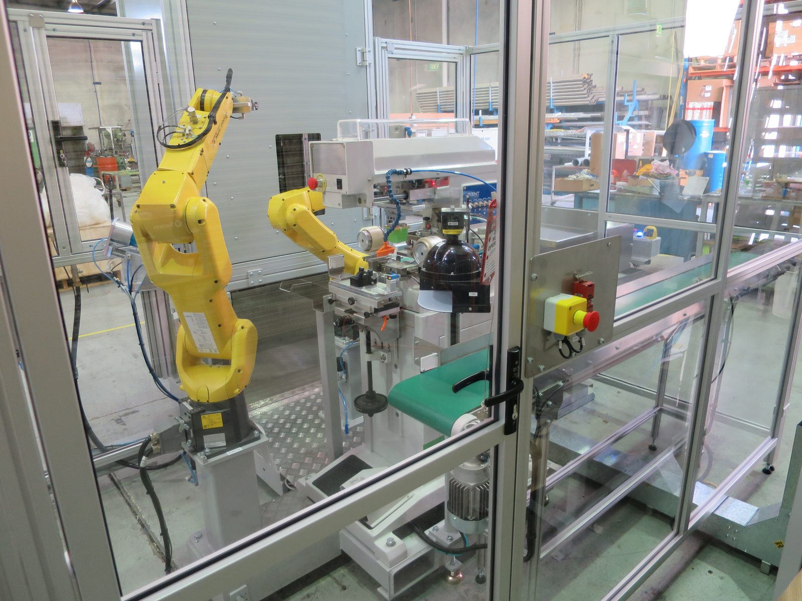 FANUC robot cell at a pad printing station