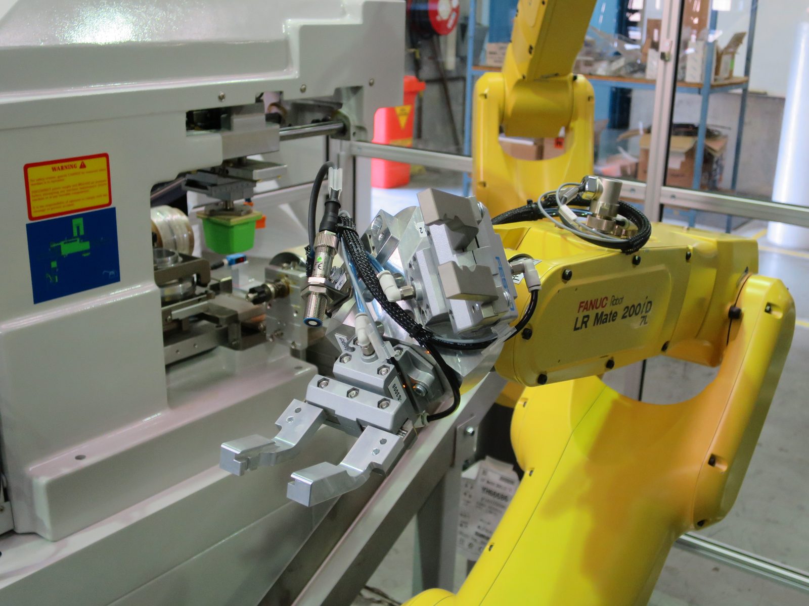 FANUC LR Mate 200iD robot with custom end-of-arm tooling
