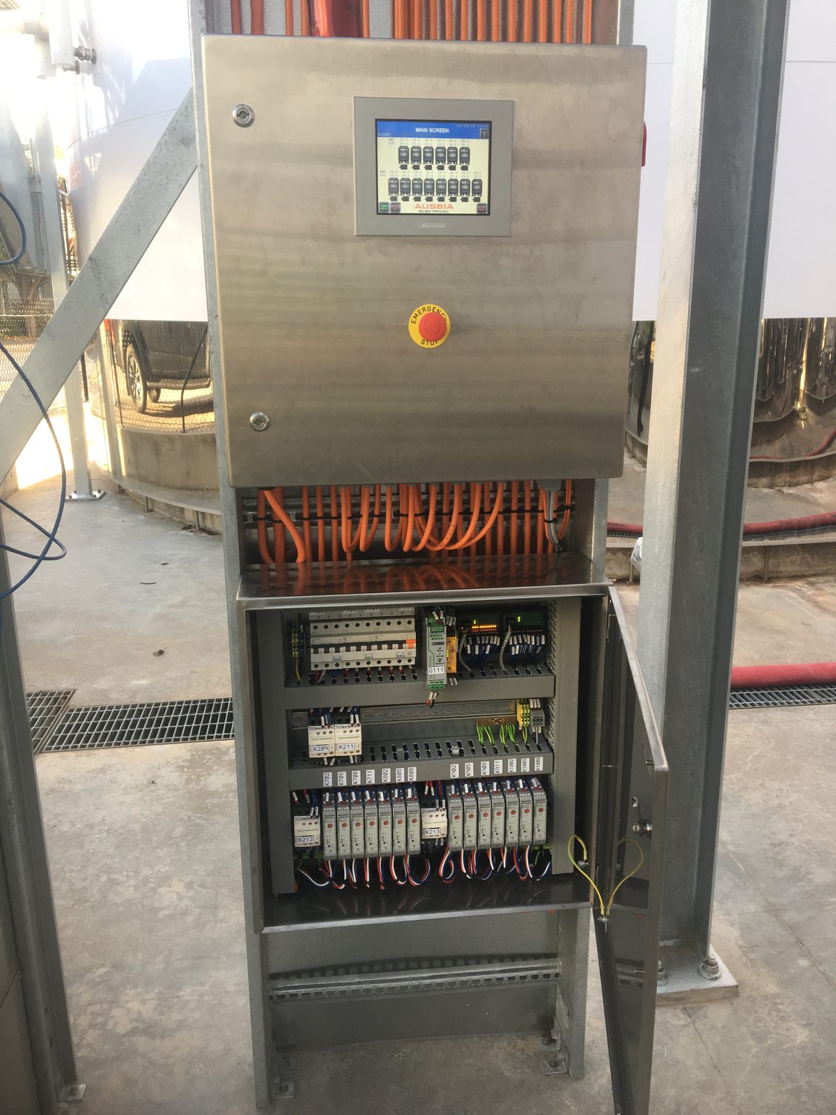 Tank control cabinet with emergency stop