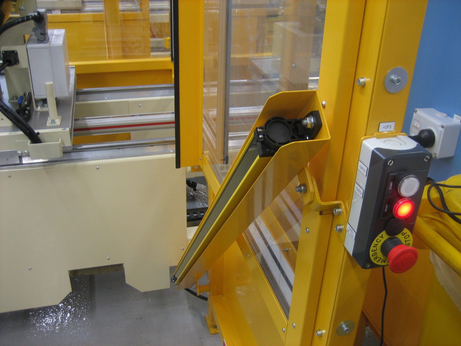 Weld cell light curtain and emergency stop station
